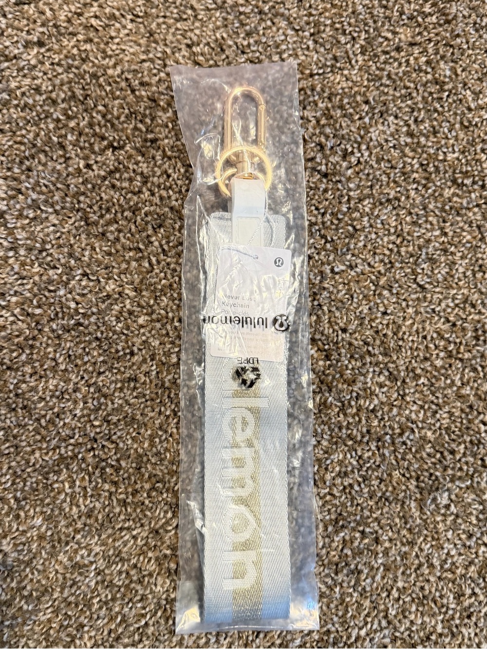 Lululemon Never Lost Keychain in the Vapor/Gold BNWT